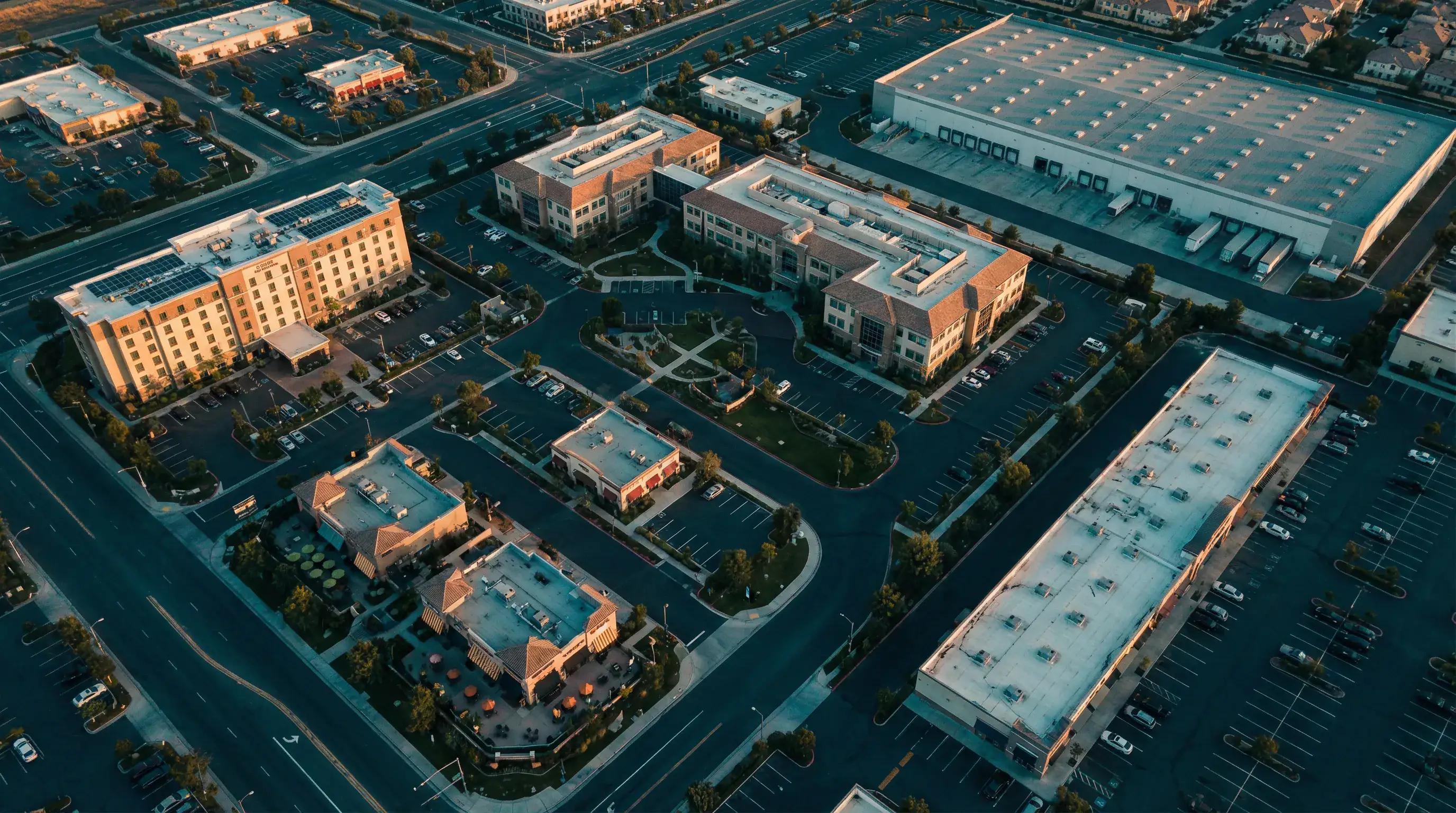 Aerial view of diverse commercial district with hotel, medical, retail for industry-specific tax playbooks